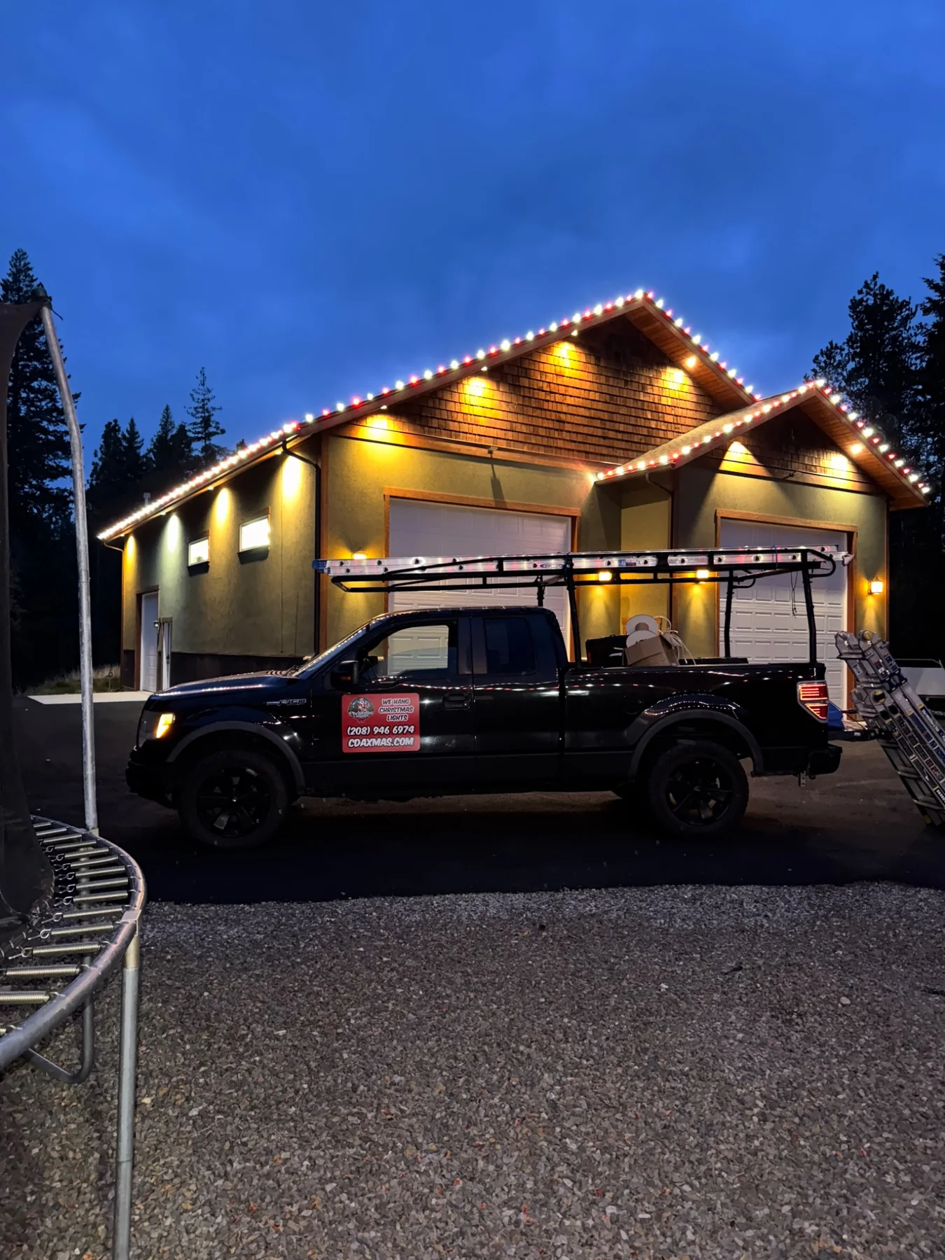 CDA Christmas Lights service truck at a completed Christmas light installation